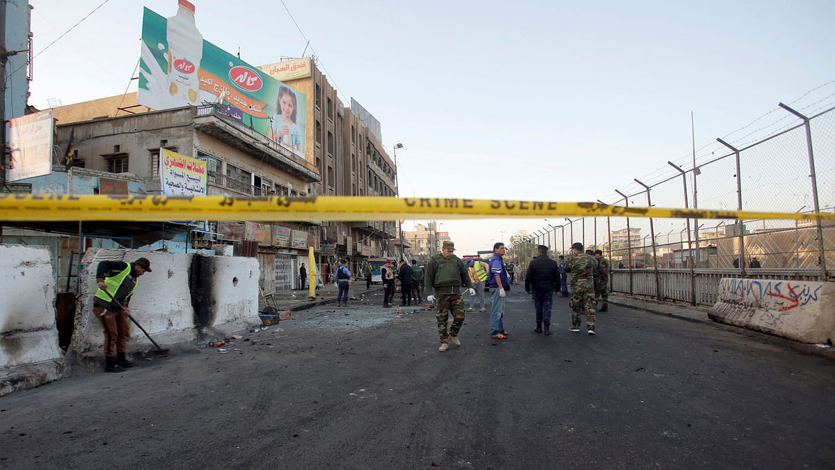 Iraqi security forces inspect the site of a bomb attack in Baghdad, Iraq 15 January, 2018. Photo: Reuters