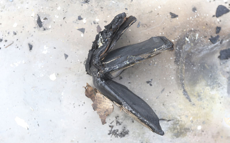 Charred remains of a wallet. Photo: Abdus Salam