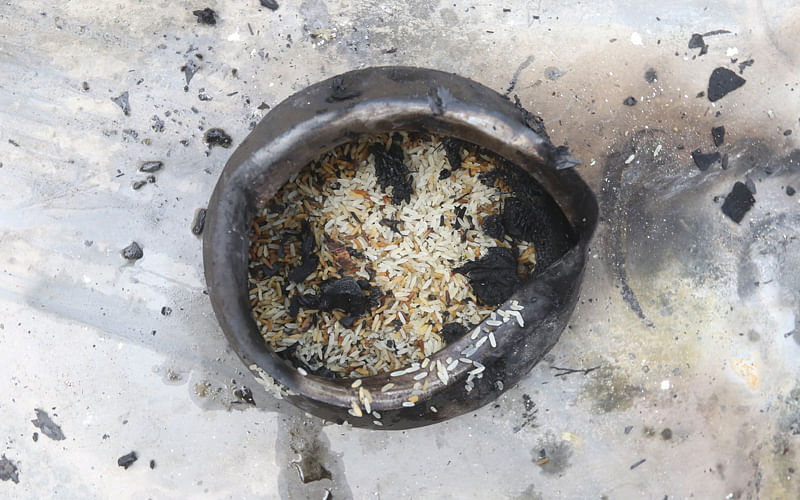 A pot of rice, burnt to cinders. Photo: Abdus Salam
