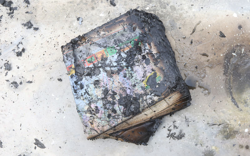 A burnt copybook, covered in ashes. Photo: Abdus Salam