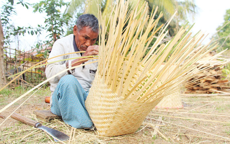 A man busy making a wicker basket in Khagracchari on 15 January. Photo: Nirab Chowdhury