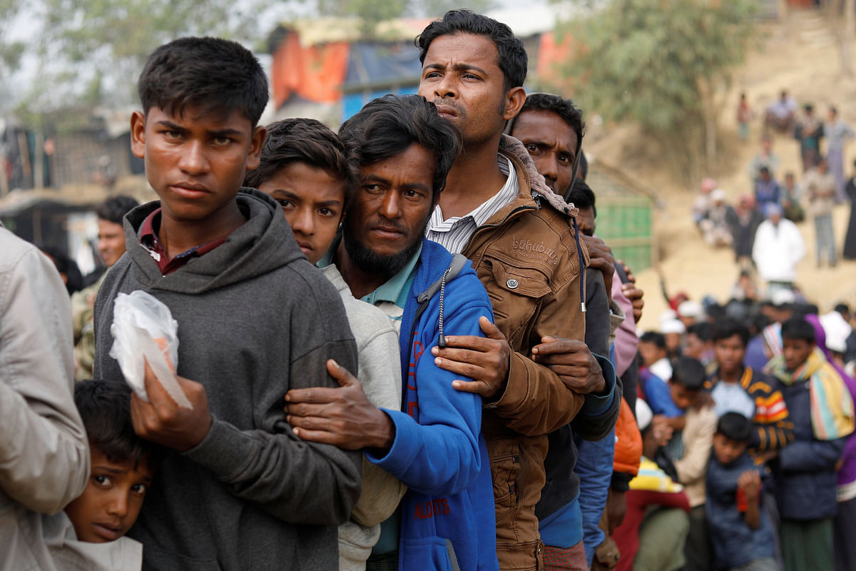 Rohingya refugees line up for daily essentials distribution at Balukhali camp, near Cox’s Bazar. Photo: Reuters