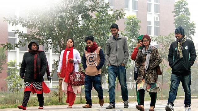 Students of Begum Rokeya University are on their way to attend class in winter morning. Photo: Moinul Islam/Prothom Alo