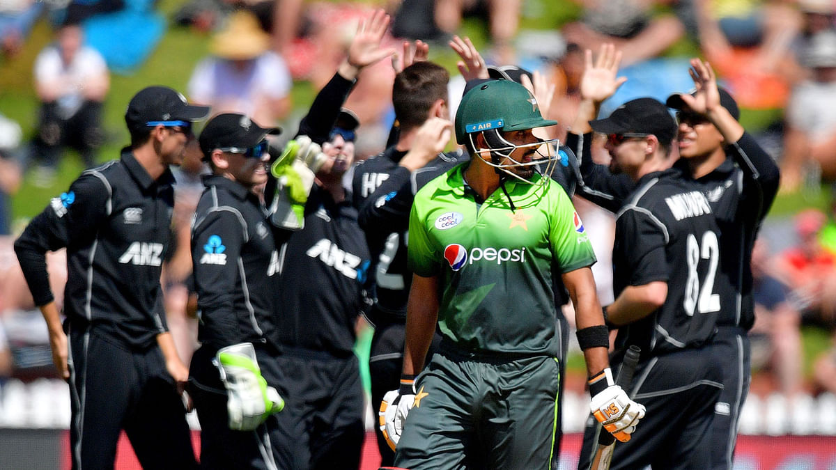 Pakistan`s Babar Azam (C) walks from the field after being caught during the 5th one-day international cricket match between New Zealand and Pakistan at the Basin Reserve in Wellington on 19 January 2018. AFP