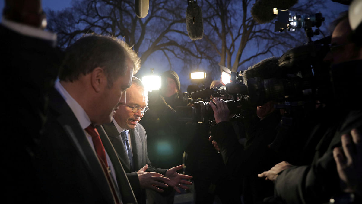 White House budget director Mick Mulvaney talks with reporters at the White House in Washington, US, on 19 January 2018. Reuters