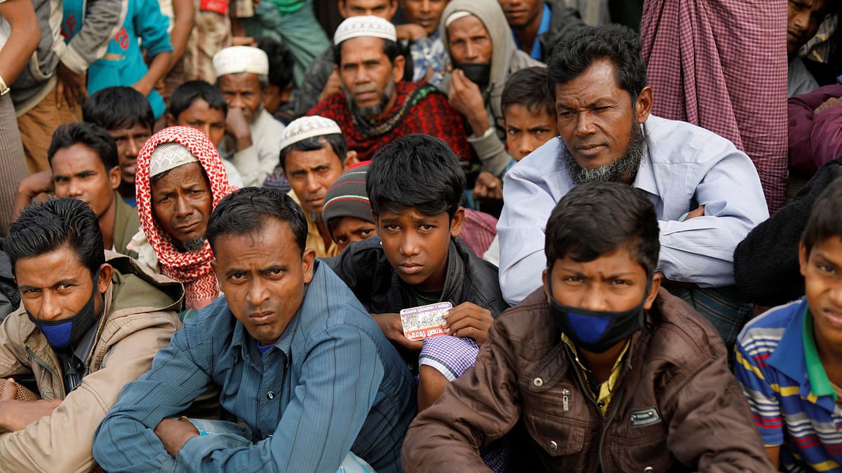 Rohingya refugees wait for food supply distribution at Balukhali camp, near Cox`s Bazar, Bangladesh on 15 January 2018. Reuters