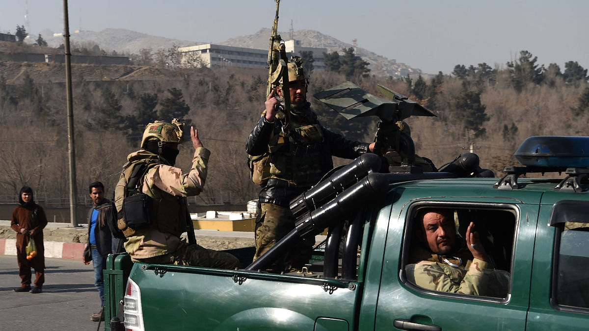 Afghan security personnel gesture as they leave the Intercontinental Hotel after an attack in Kabul on 21 January, 2018. Photo: AFP