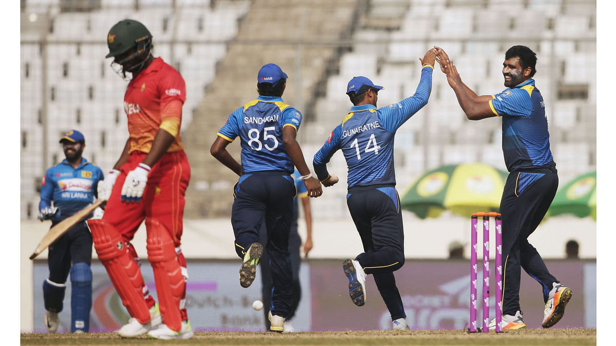 Sri Lankan cricketer Thisara Perera celebrates after the dismissal of Zimbabwe cricketer Solomon Mire during the fourth One Day International (ODI) cricket match in the Tri-Nations Series at the Sher-e-Bangla National Cricket Stadium in Dhaka on 21 January 2018. AFP