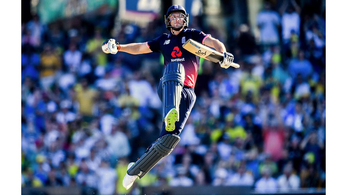 England`s Jos Buttler celebrates after scoring a century during the one-day international match against Australia at the Sydney Cricket Ground in Sydney, Australia, on 21 January 2018. Reuters