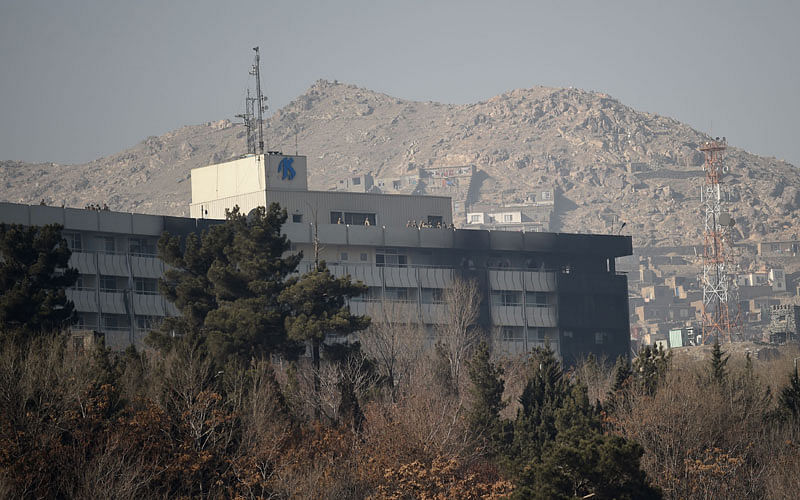 Afghan security personnel are seen on the rooftop of the Intercontinental Hotel after an attack in Kabul on 21 January, 2018. Photo: AFP