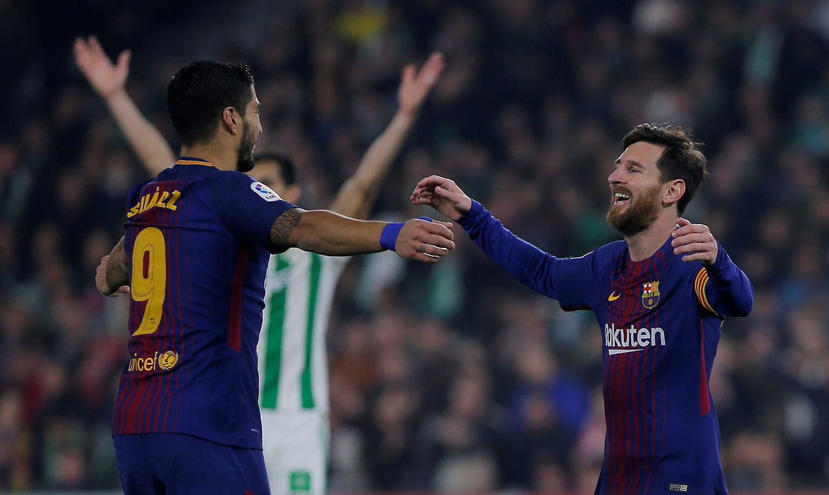 Barcelona’s Luis Suarez and Lionel Messi celebrate a goal against Real Betis at Estadio Benito Villamarin, Seville, Spain. Photo: Reuters