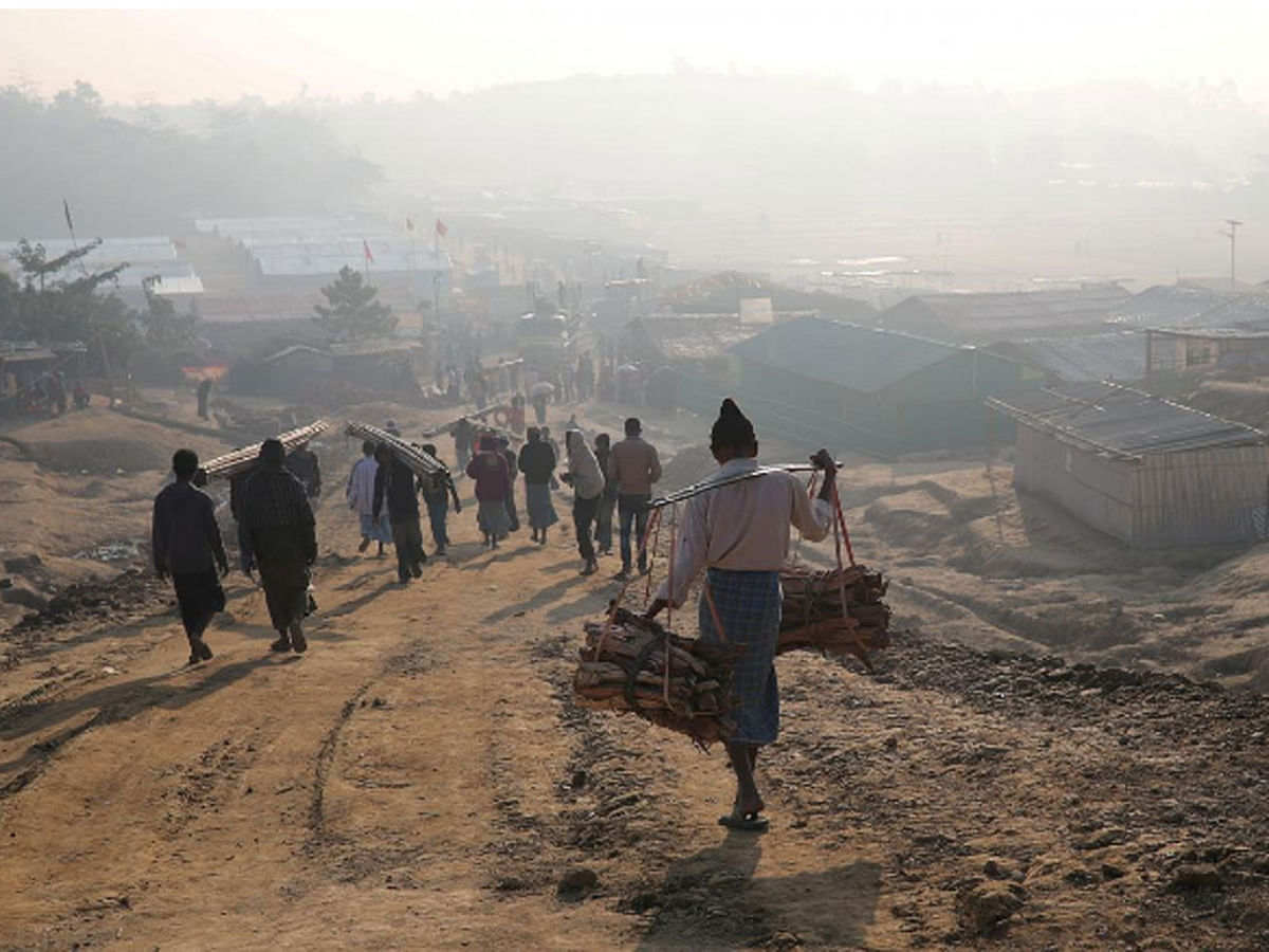 Rohingyas walk at Jamtoli camp in the morning in Cox`s Bazar on 22 January 2018. -- Reuters