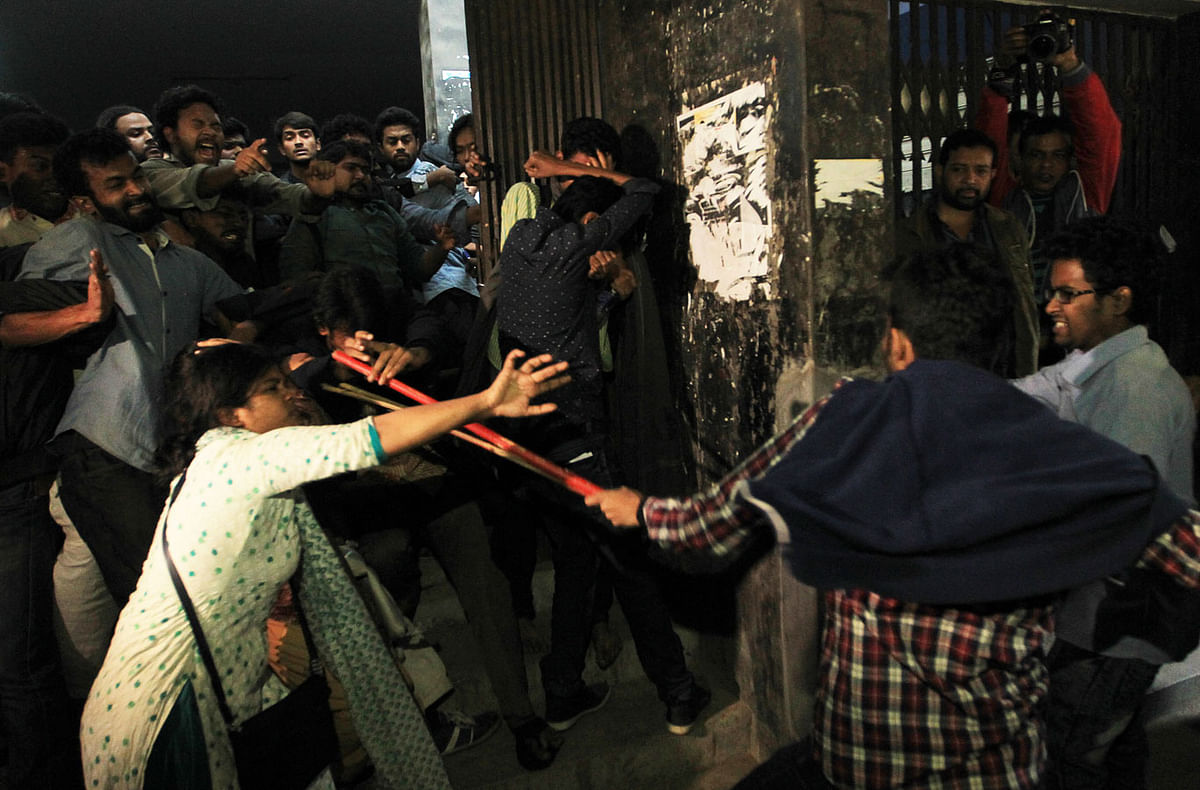 A female student tries to defend herself when BCL activists attack demonstrators in front of the VC`s office on Tuesday. Photo: Sajid Hossain