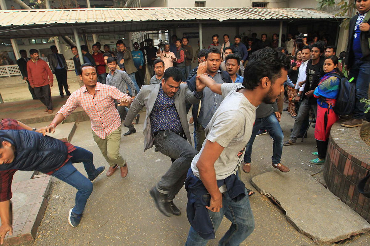 Bangladesh Chhatra League leaders assault agitating students to disperse them from VC`s office on Tuesday afternoon. Photo: Sajid Hossain