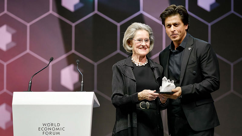 Bollywood actor Shah Rukh Khan receives a Crystal Award from Schwab Foundation for Social Entrepreneurship Chairperson and Co-Founder Hilde Schwab on 22 January 2018.