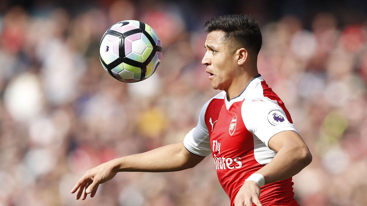 Arsenal’s Chilean striker Alexis Sanchez watching the ball during the English Premier League football match between Arsenal and Manchester United at the Emirates Stadium in London. AFP file photo