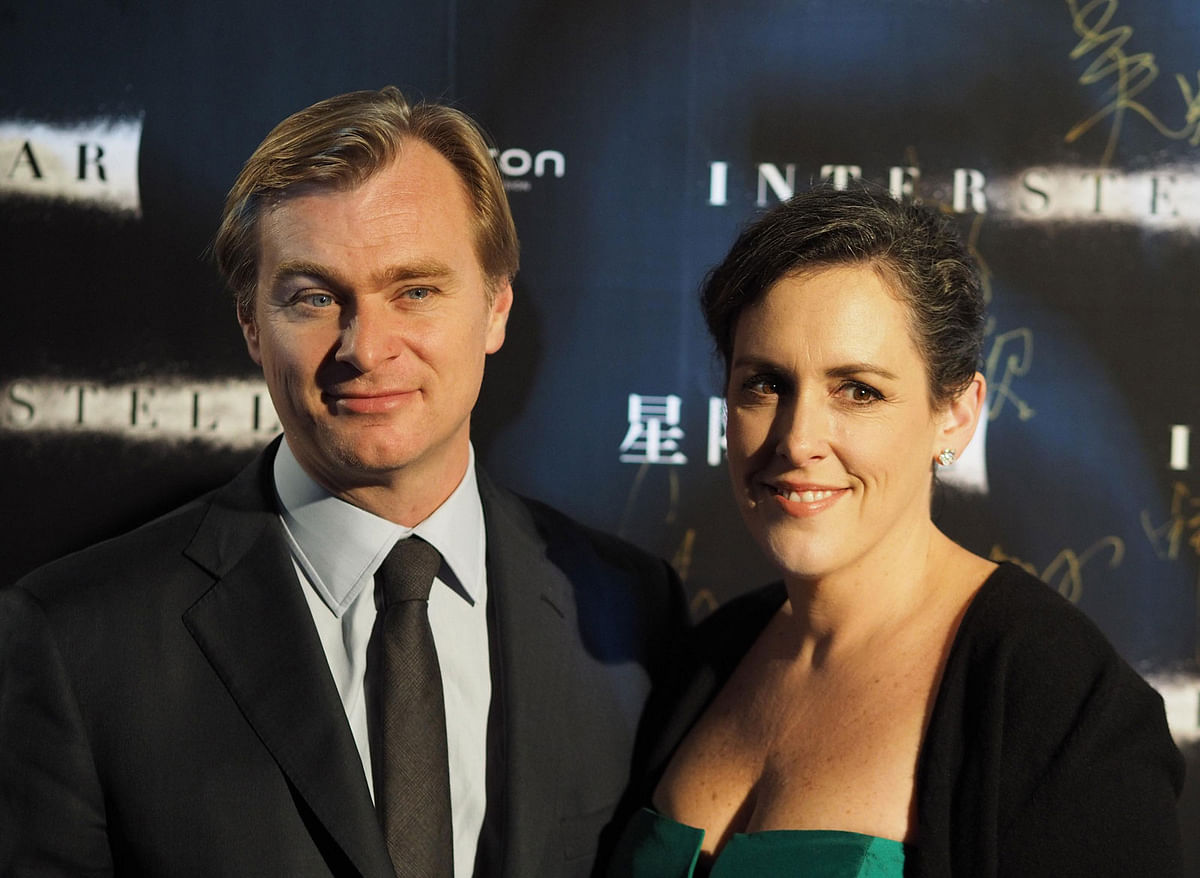 Director Christopher Nolan with his wife and producer Emma Thomas attend the Asia`s premiere of the movie `Interstellar` in Shanghai Xintiandi. Photo: IANS