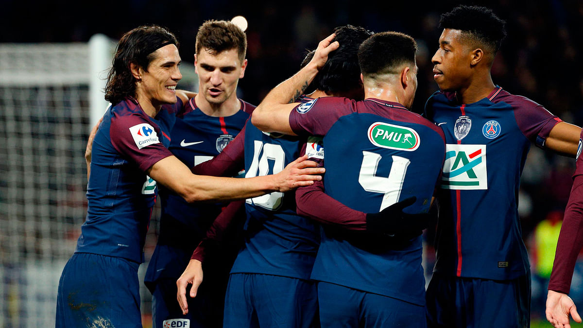 Paris Saint-Germain’s Argentinian midfielder Javier Pastore © celebrates with teammates after scoring a goal during the French Cup round of 16 football match between Paris Saint-Germain (PSG) and Guingamp (EAG) at the Parc des Princes stadium in Paris on Wednesday. Photo: AFP