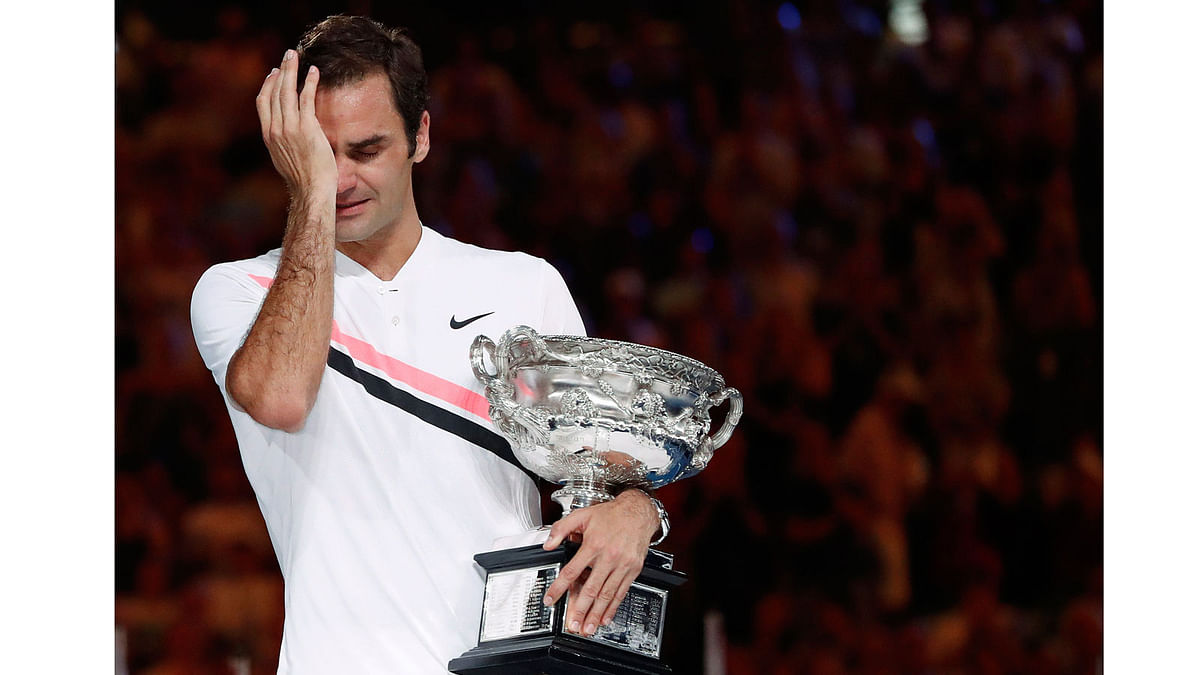 Tennis - Australian Open - Men’s singles final - Rod Laver Arena, Melbourne, Australia on 28 January 2018. Winner Roger Federer of Switzerland cries as he holds the trophy. Photo: Reuters
