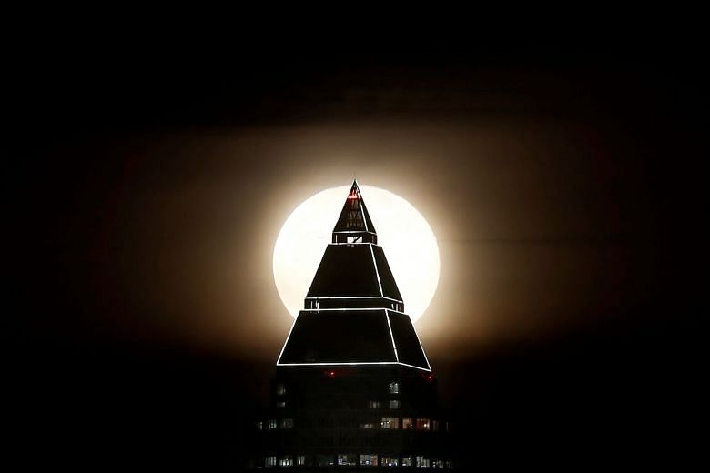 The event is causing a buzz because it combines three unusual lunar events - an extra big super moon, a blue moon and a total lunar eclipse. Photo: Reuters