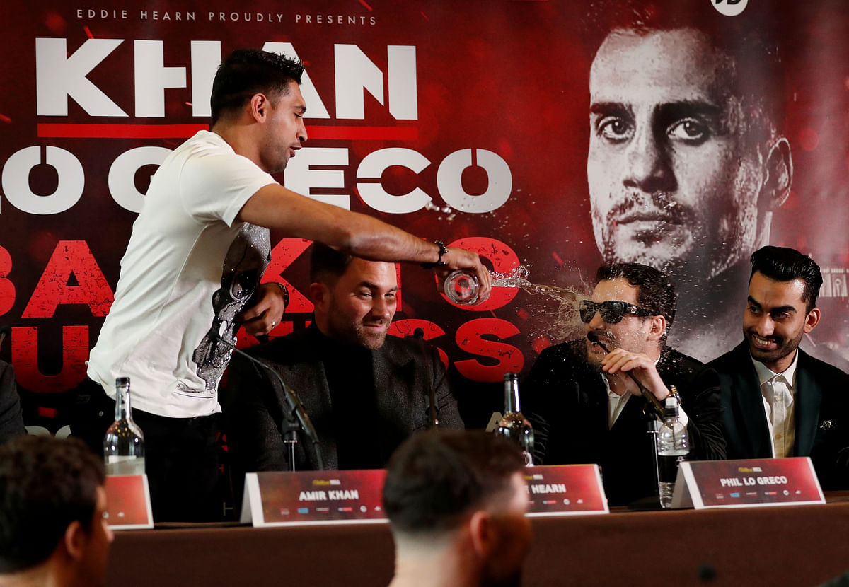 Boxing - Amir Khan Press Conference - Liverpool, Britain - Amir Khan throws water into the face of Phil Lo Greco during the press conference on 30 January 2018. Photo: Reuters
