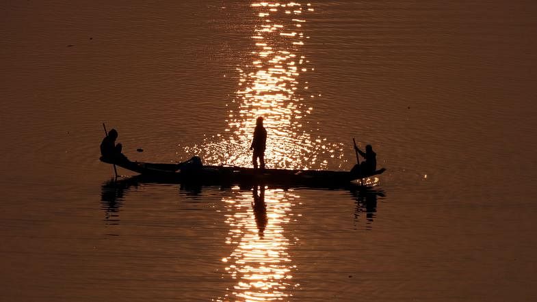 Fishermen catch fish at dawn in the Surma river at Tukerbazar area of Sylhet Sadar on 30 January. Photo: Anis Mahmud