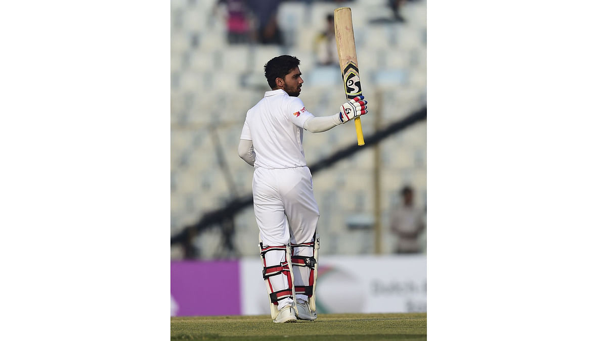 Bangladesh cricketer Mominul Haque reacts after scoring 150 runs during the first day of the first cricket Test between Bangladesh and Sri Lanka at Zahur Ahmed Chowdhury Stadium in Chittagong on 31 January 2018. Photo: AFP