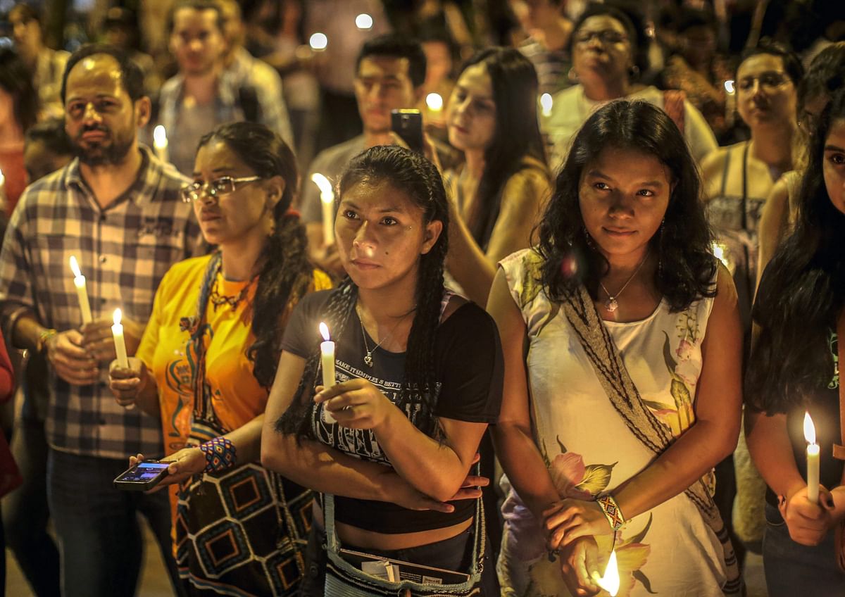 People take part in a tribute to social leaders murdered in Colombia, in Medellin on 31 January 2018. According to the Public Prosecutor`s Office, 101 social leaders were murdered between 1 January 2017 and 31 January 2018 in Colombia. Photo: AFP