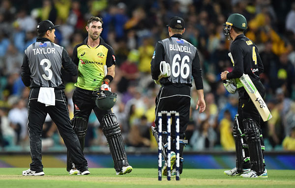 Australia’s Glenn Maxwell (2nd L) greets New Zealand’s Ross Taylor (L) and Tom Blundell after Australia’s victory in their Twenty20 cricket match at the Sydney Cricket Ground in Sydney on Saturday. Photo: AFP