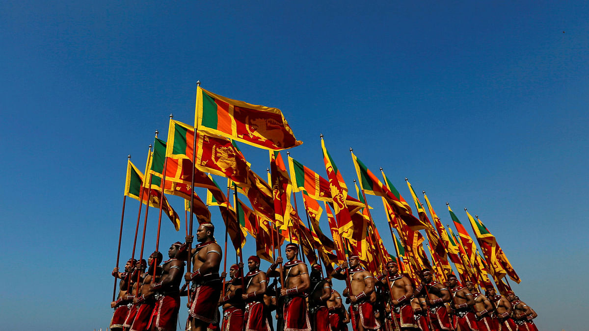 Sri Lanka`s military members march with the national flags at the parade during a rehearsal for Sri Lanka`s 70th Independence day celebrations in Colombo, Sri Lanka on 2 February 2018. Photo: Reuters