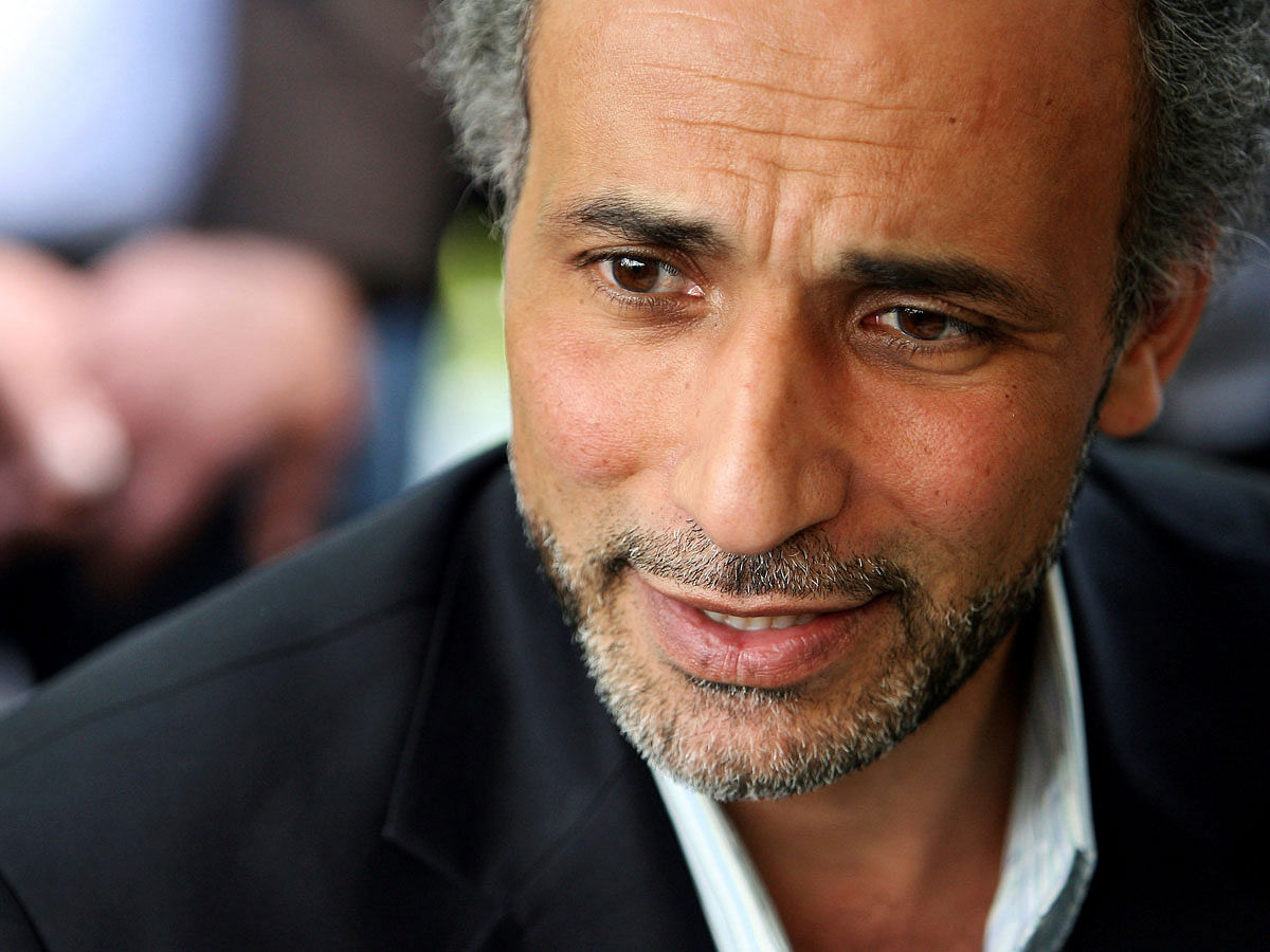 Author Tariq Ramadan, a professor of Islamic studies at the University of Oxford, has been taken into custody by French police following accusations of rape, according to a judicial source on 31 January 2018. The picture taken 25 April 2010 shows Ramadan, talking with a journalist after a conference at the Er-Rahma mosque in Nantes, France. Reuters