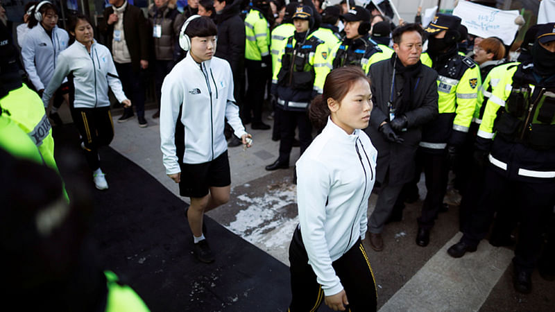 Athletes from the Inter-Korean women`s ice hockey team arrive before their friendly match against Sweden in Incheon, South Korea. Reuters