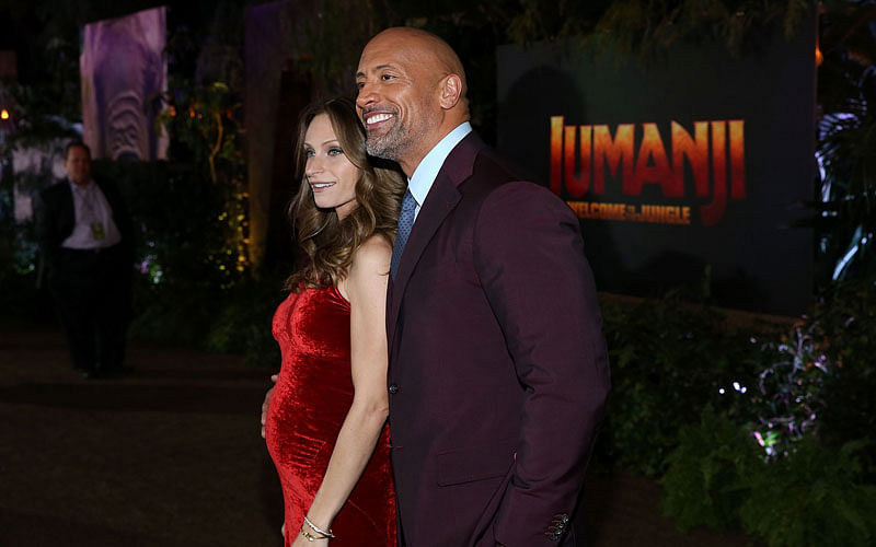 In this file photo taken on 11 December, 2017 shows (L-R) Lauren Hashian and Dwayne Johnson attending the premiere of Columbia Pictures` `Jumanji: Welcome To The Jungle` in Hollywood, California. Photo: AFP