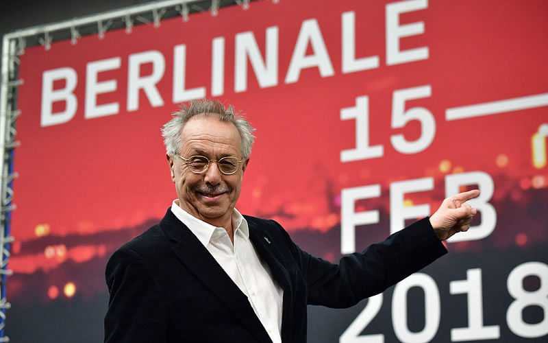 Berlinale Director Dieter Kosslick points at the poster of the 68th Berlinale as he poses for photographers during a press conference prior to the 68th Berlinale film festival in Berlin on 8 February, 2018. Photo: AFP