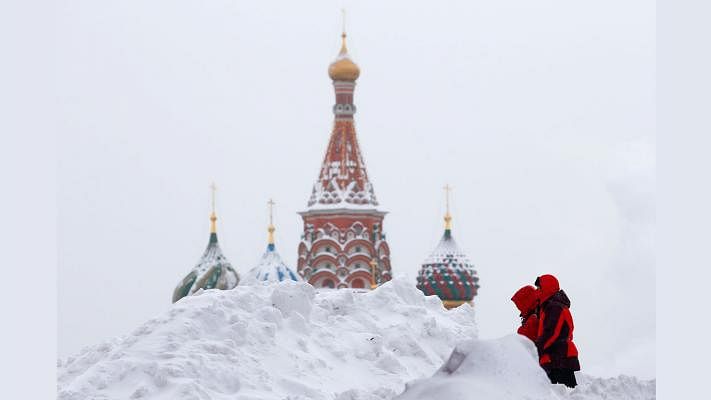 People walk in Red Square near the St Basil`s Cathedral after a heavy snowfall in central Moscow, Russia on 5 February 2018. Reuters