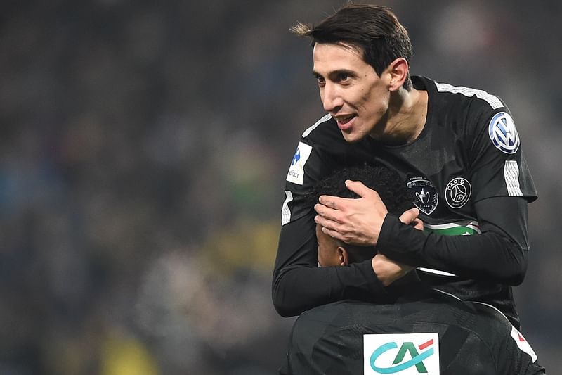 Paris Saint-Germain’s Argentinian forward Angel Di Maria (TOP) is congratulated by Paris Saint-Germain’s French defender Presnel Kimpembe ® after scoring during the French Cup football match between Sochaux (FCSM) and Paris Saint-Germain (PSG) on Tuesday.