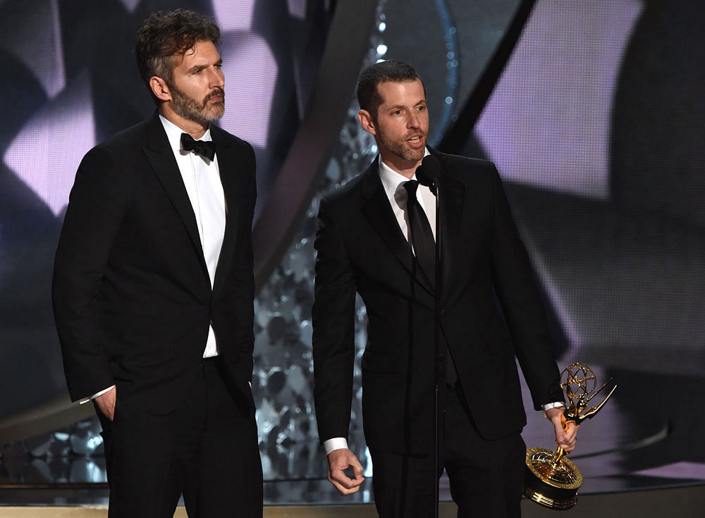 In this file photo taken on 18 September, 2016 writer and producers David Benioff (L) and DB Weiss accept the Outstanding Writing for a Drama Series for `Game of Thrones` episode Battle of the Bastards during the 68th Emmy Awards show in Los Angeles. Photo: AFP