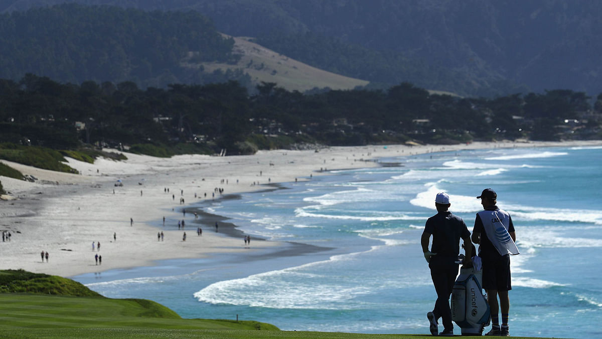 Paul Casey of England prepares to play his second shot into the ninth green during Round One of the AT&T Pebble Beach Pro-Am at Pebble Beach Golf Links on 8 February 8, 2018 in Pebble Beach, California. Photo: AFP