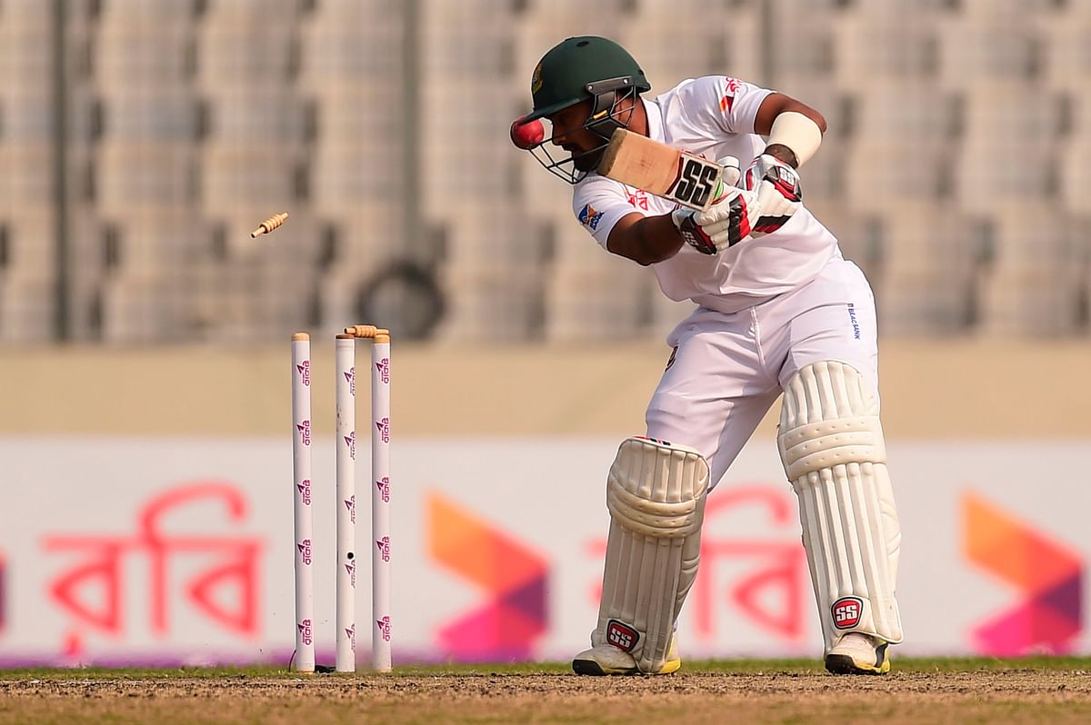 Liton Das is bowled by Sri Lanka`s Suranga Lakmal during the second day of the second cricket Test between Bangladesh and Sri Lanka at the Sher-e-Bangla national cricket stadium in Dhaka on 9 February 2018. AFP