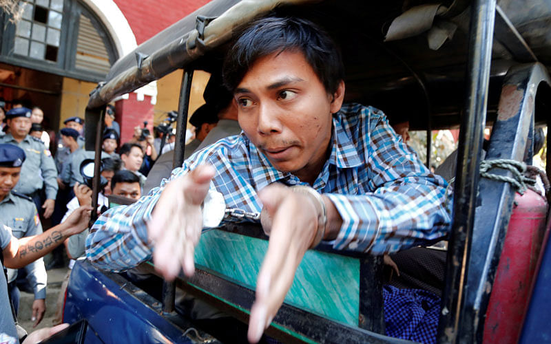 Detained Reuters journalist Kyaw Soe Oo talks to journalists after a court hearing in Yangon, Myanmar on 6 February 2018. Reuters
