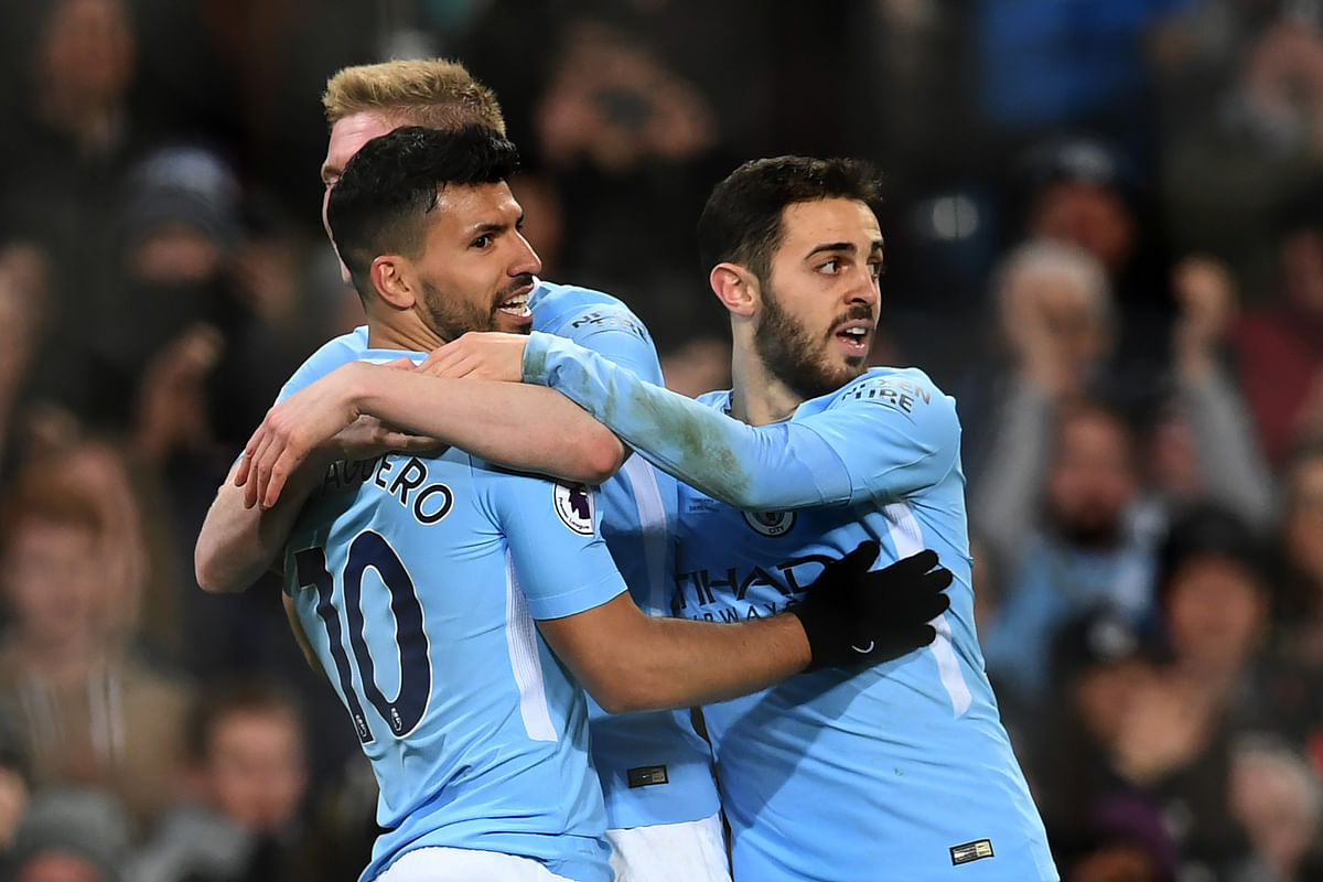 Manchester City’s Argentinian striker Sergio Aguero (L) celebrates with teammates scoring the team’s fourth goal during the English Premier League football match between Manchester City and Leicester City at the Etihad Stadium in Manchester, north west England, on Saturday. Photo: AFP