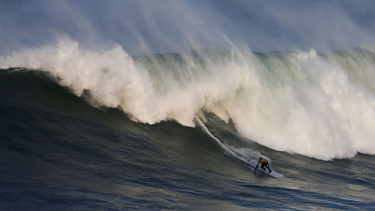 Hawaiian big wave surfer Nathan Florence surfs a wave during the Nazare Challenge championship at Praia do Norte in Nazare, Portugal on 10 February 2018. Photo: Reuters