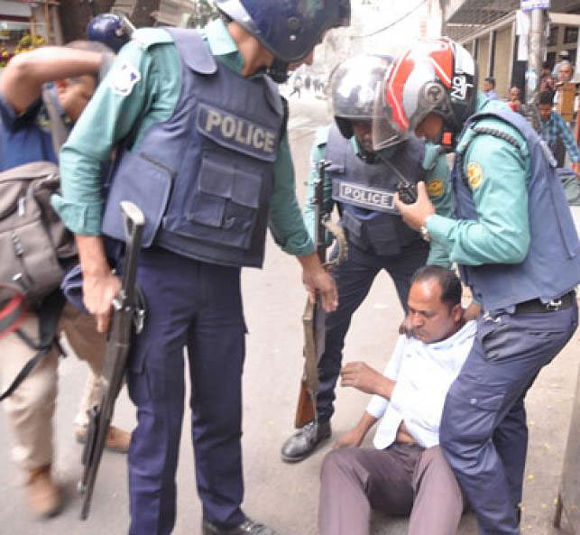 Police arrest a BNP man from a procession in Bijoynagar of the capital. Photo: Collected