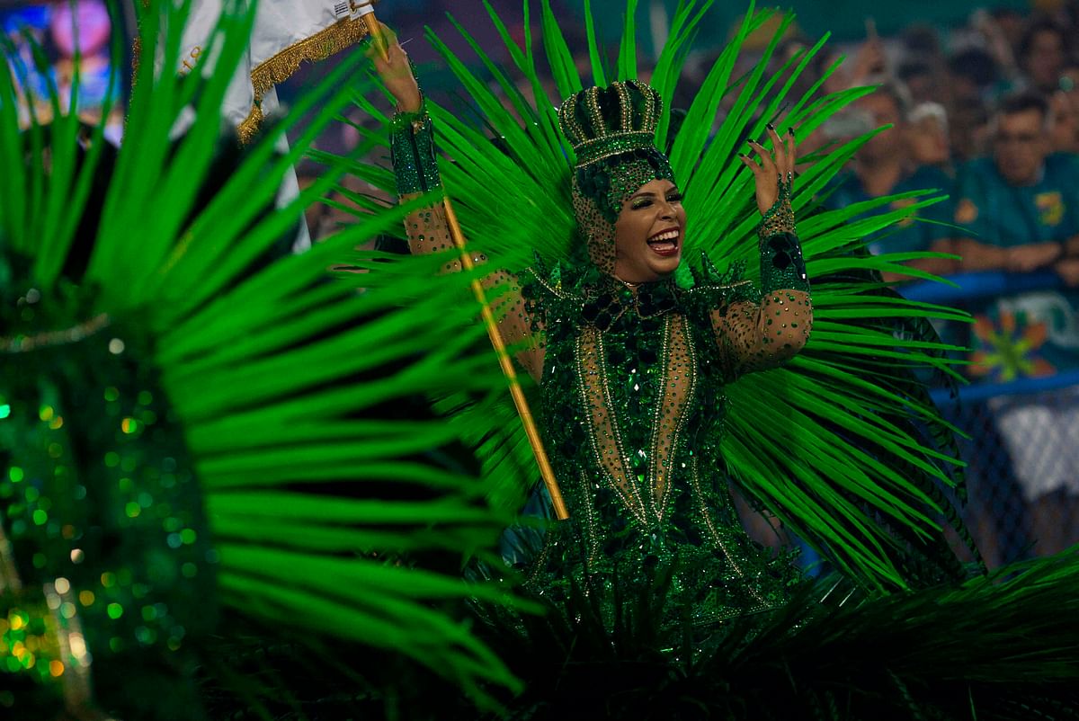 A reveller of the Imperatriz Leopoldinense samba school performs during the second night of Rio`s Carnival at the Sambadrome in Rio de Janeiro, Brazil, on 13 February, 2018. Photo: AFP