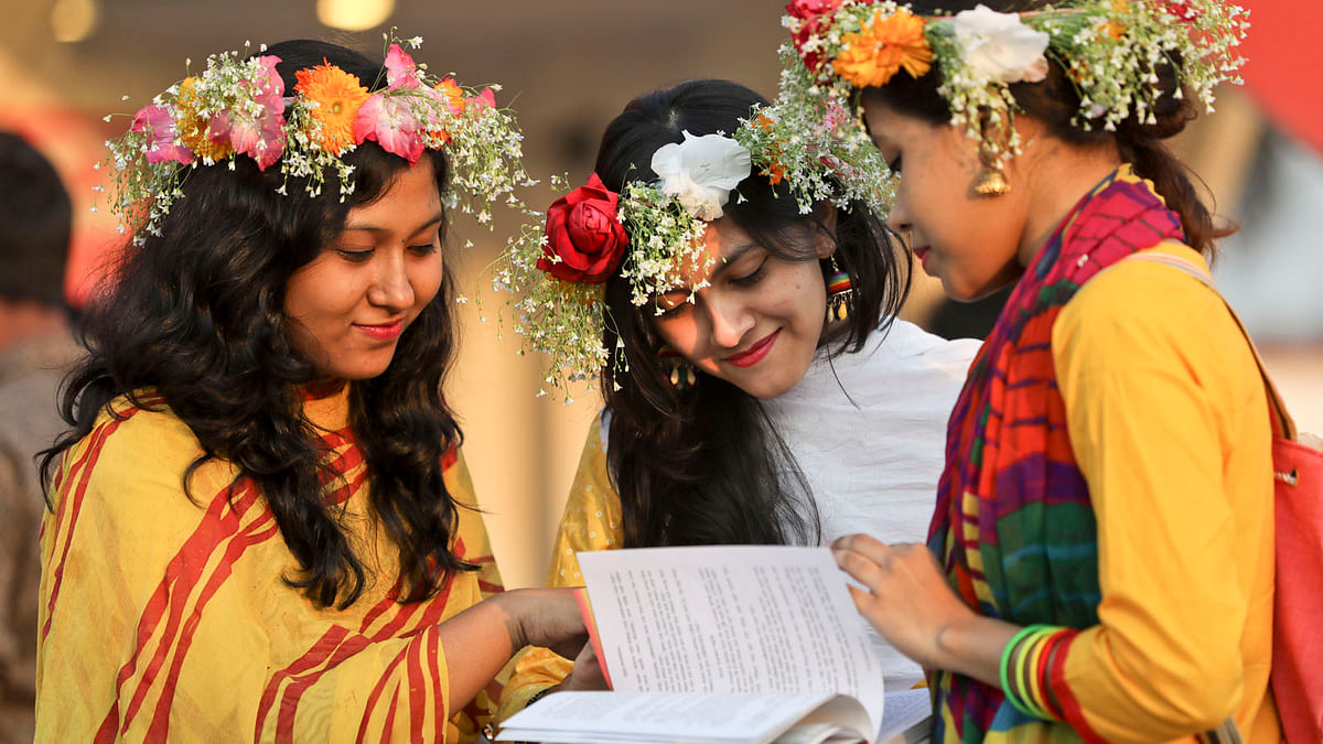 These three revellers were photographed a day before Pahela Falgun during month long book fair in the city on 12 February 2018. Phot: Prothom Alo