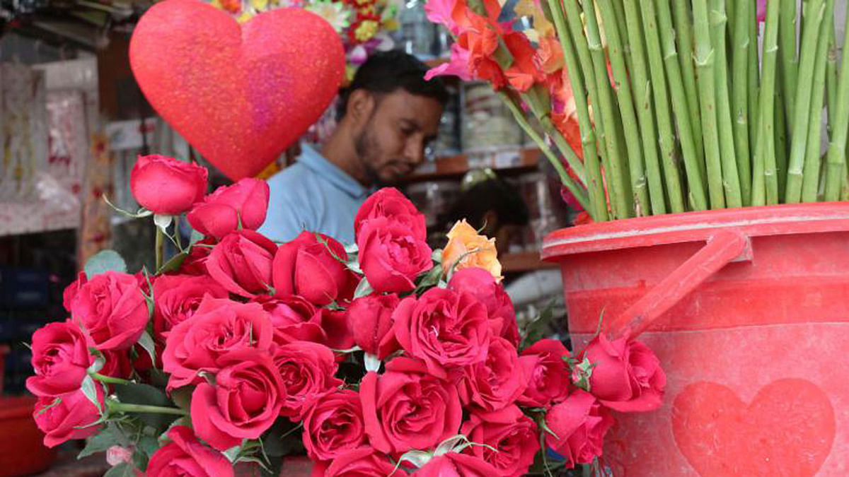 Red roses are displayed in front of a shop in Pabna to be sold on the occasion of Valentine`s Day on Tuesday. Photo: Hassan Mahmud