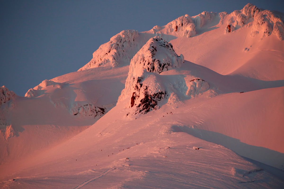 At sunset, climbers and rescue personnel descend Mount Hood, Oregon, US on 13 February 2018. Photo: Reuters