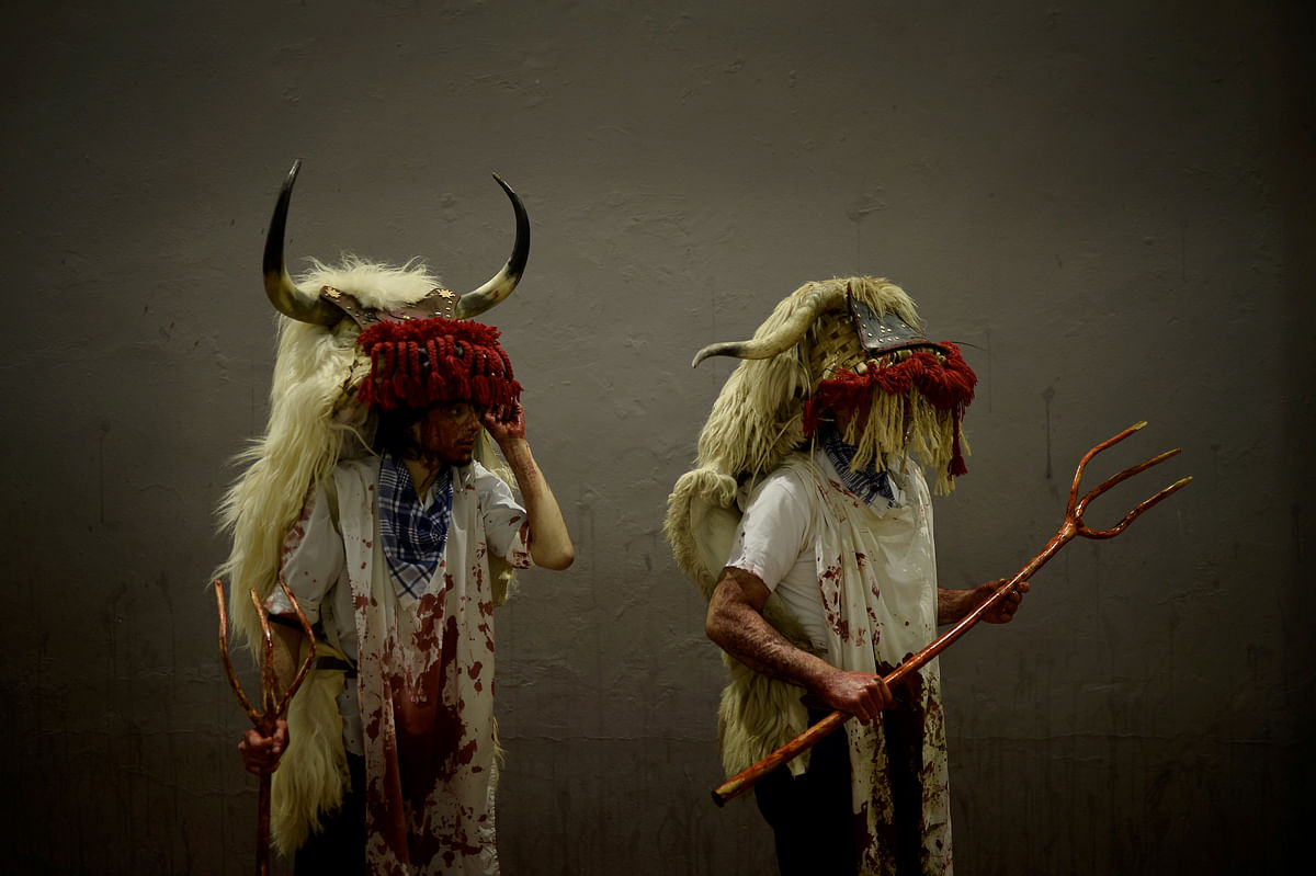 Peoople dressed as Momotxorros, half bull, half man figures dressed in blood soaked sheepskins, take part in carnival celebrations in Alsasua, Spain on 13 February 2018. Photo: Reuters