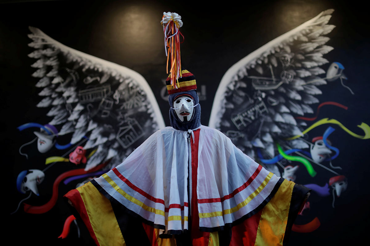 A member of the `Group Boi Faceiro` poses for a photo during carnival festivities in Sao Caetano de Odivelas, Brazil on 13 February 2018. Photo: Reuters