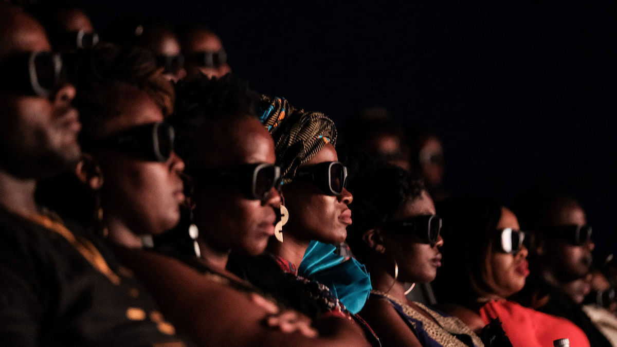 Invited guests watch the film `Black Panther` in 3D which featuring Oscar-winning Mexico born Kenyan actress Lupita Nyong’o during Movie Jabber’s Black Panther Cosplay Screening in Nairobi, Kenya, on 14 February, 2018. Photo: AFP